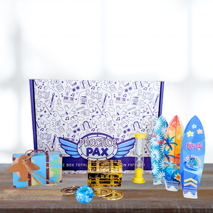 Practice Pax Subscription box with a treasure chest activity, a surf board wipeout activity, a timer tool, and a mini suitcase. 